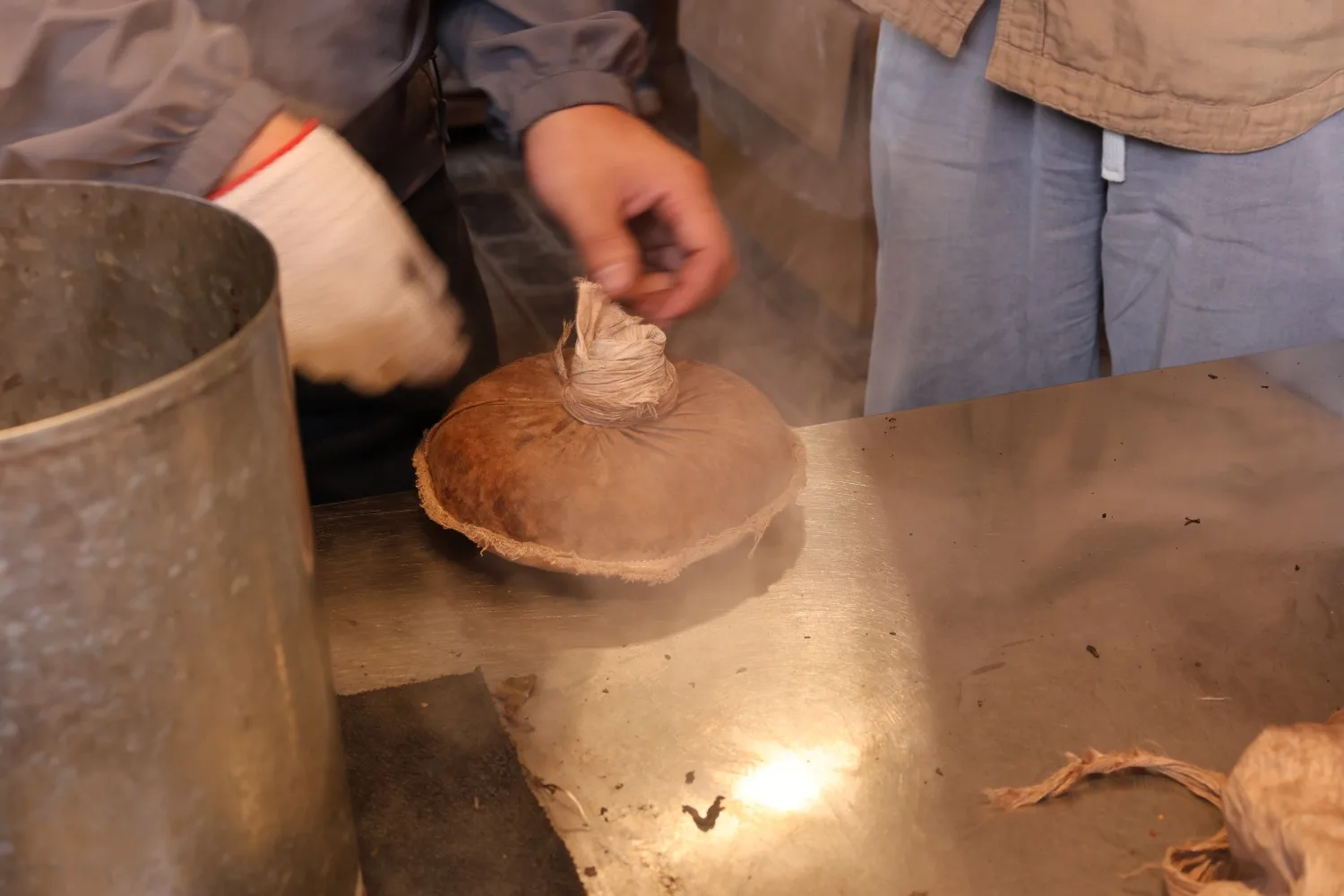 PuEr Tea Cake Making Step 3 Twist and Press Tea Bag